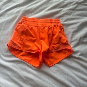 Lululemon hotty hot high rise 2.5 size 4 in a neon orange color